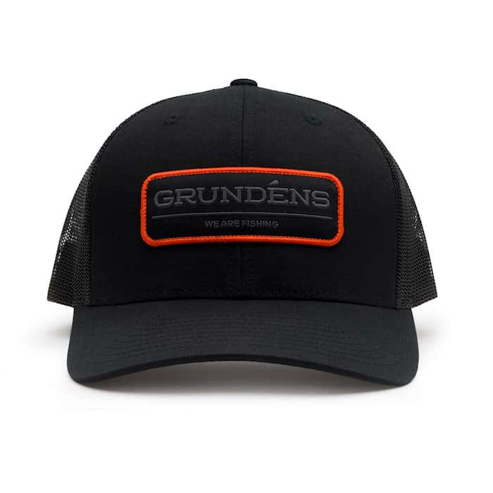 Grundens We Are Fishing Trucker Hat, in Solid Black | by West Marine